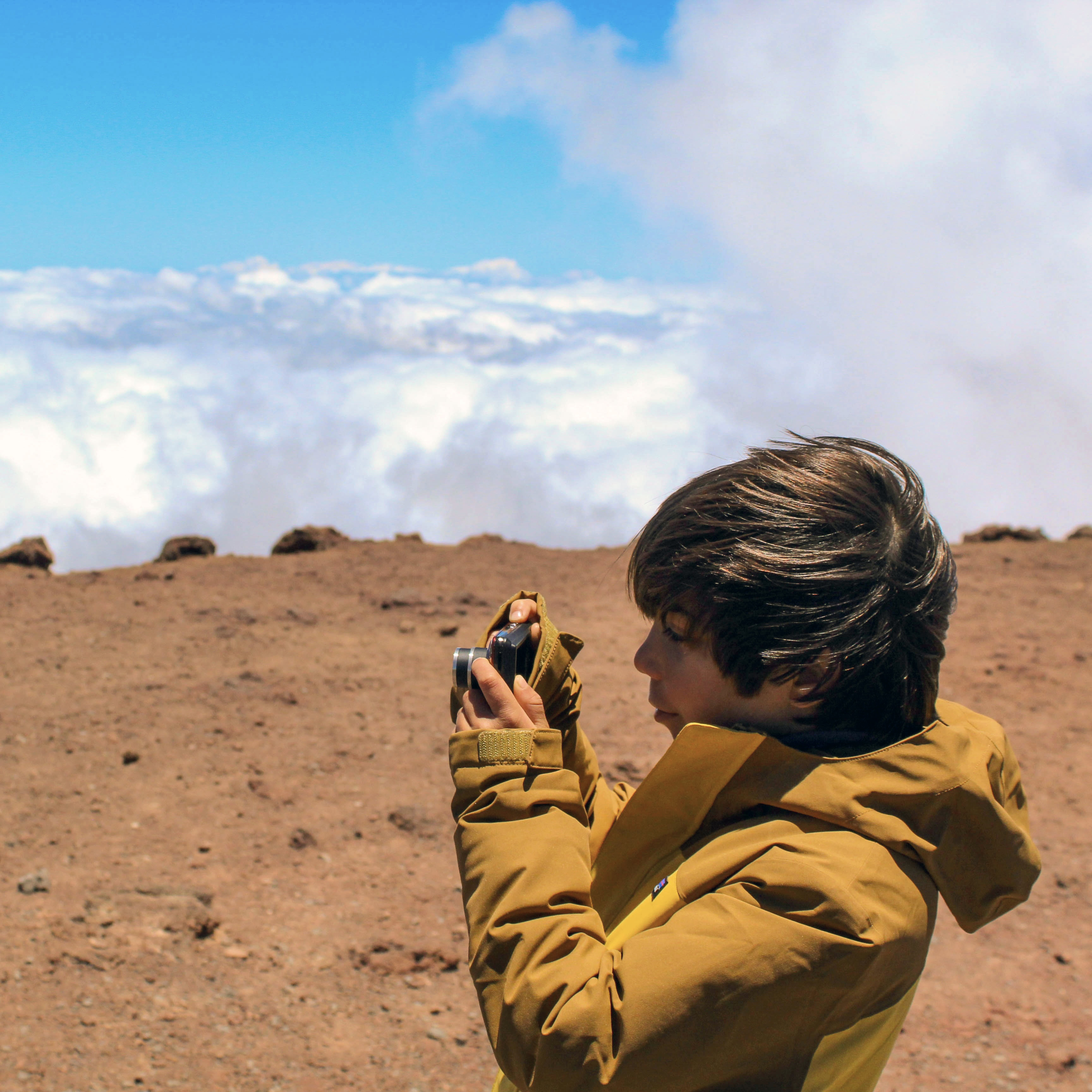 Image of a boy taking a picture.