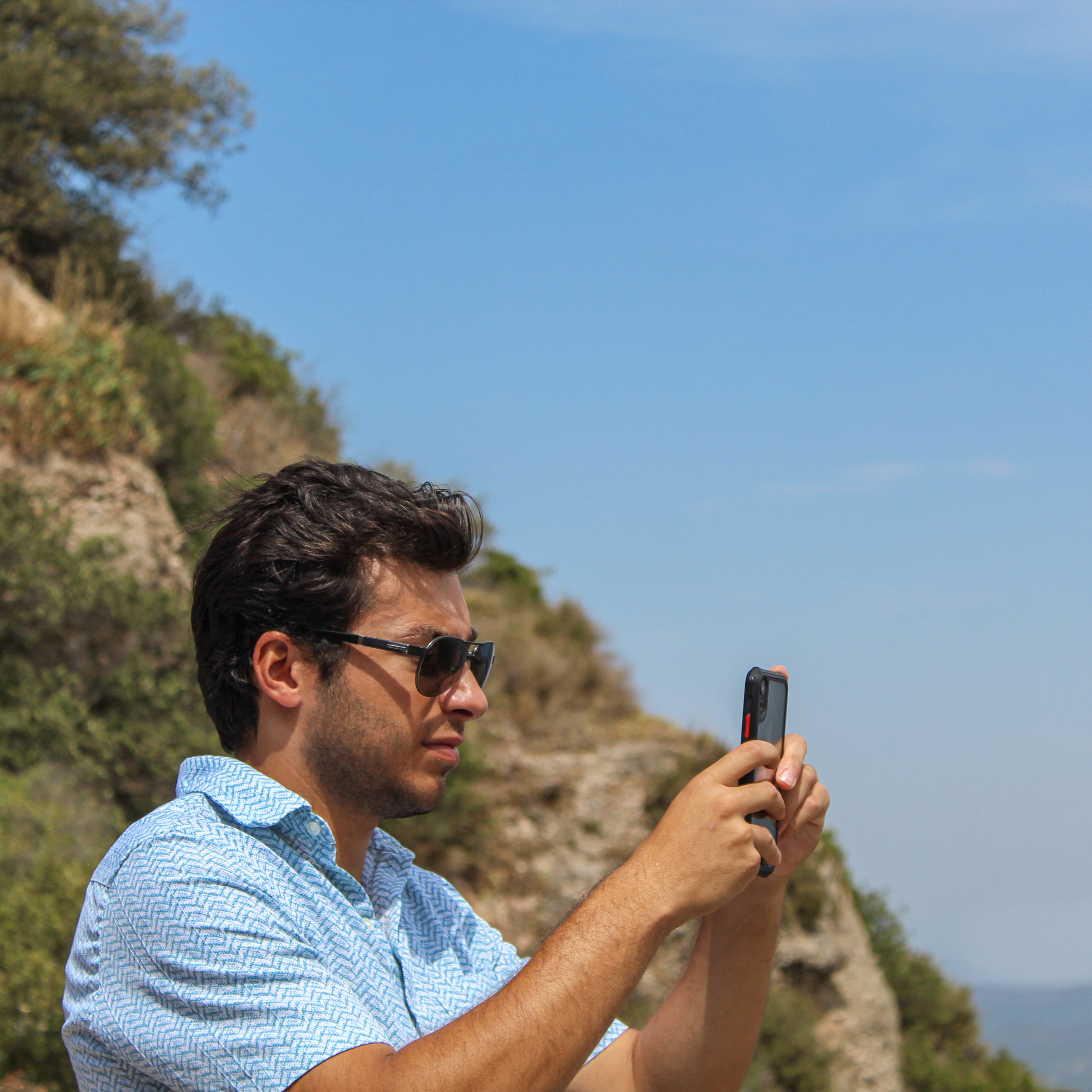 Image of a man taking a picture.