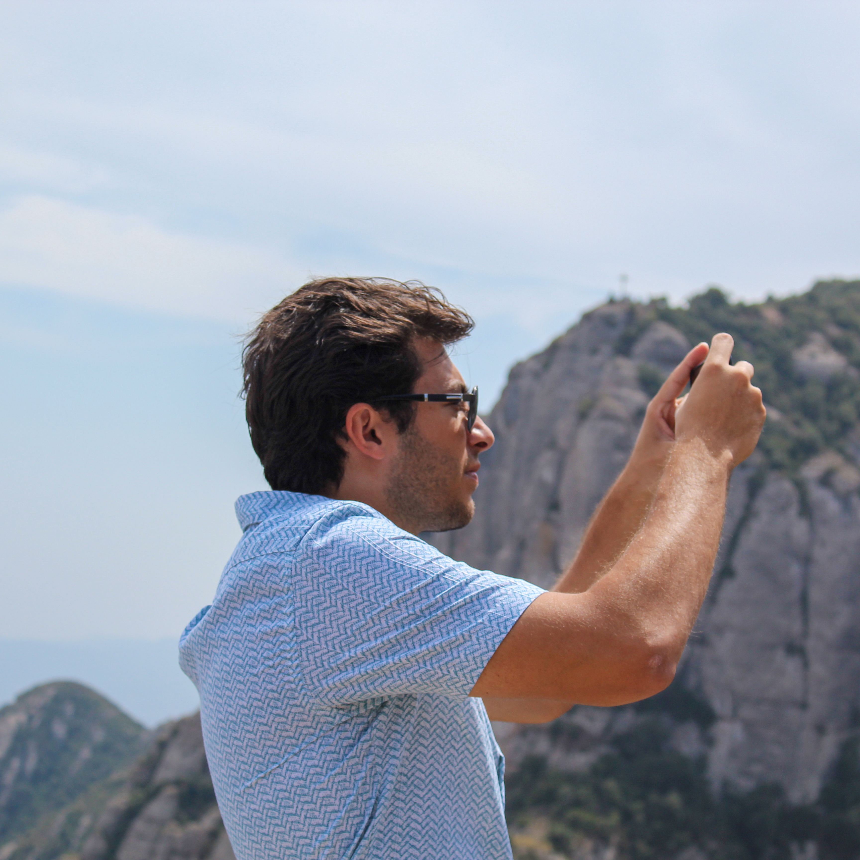 Image of a man taking a picture.