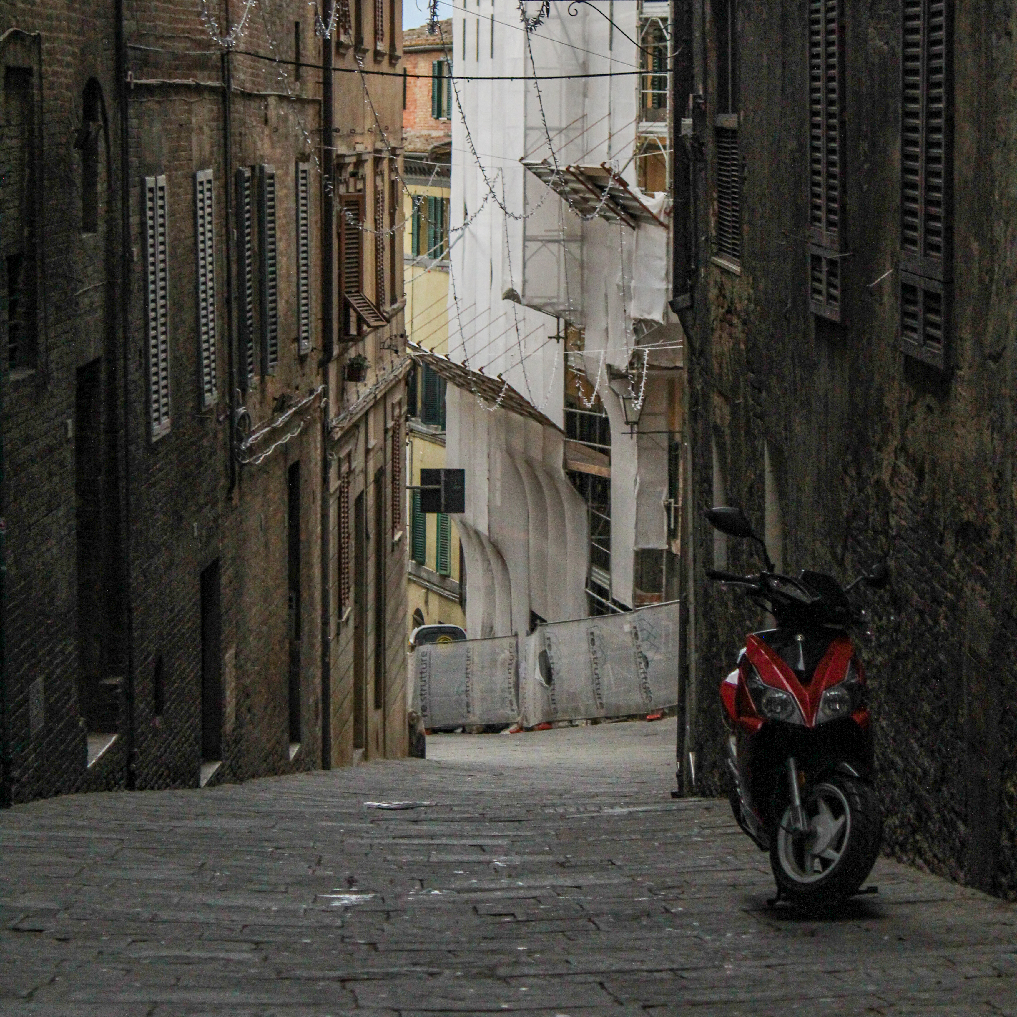 Image of a road with a vespa.